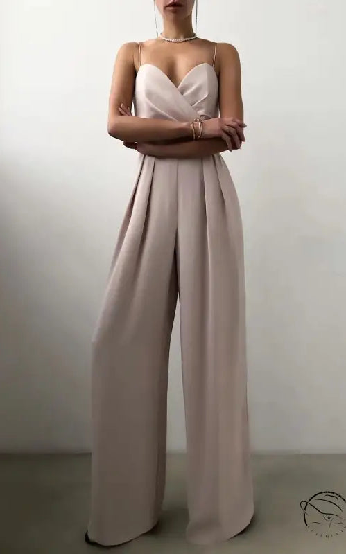 Elegant strapless beige modern jumpsuit with pleated wide-leg pants