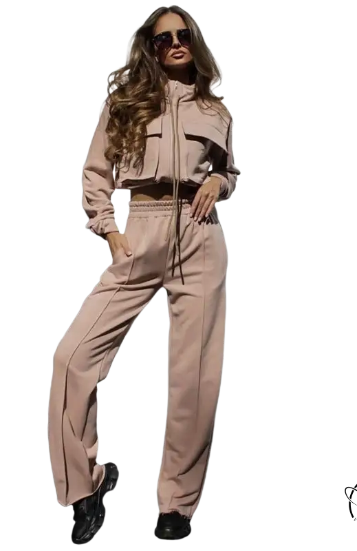 Woman in elegant vetements suit with long sleeve beige tracksuit