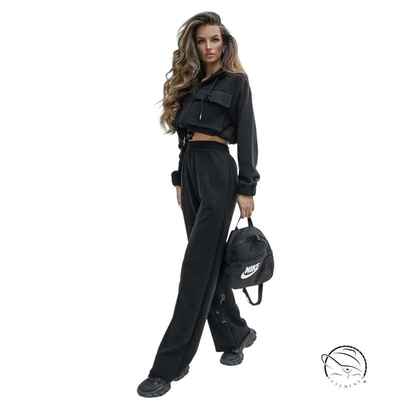 Woman in elegant Vetements suit with long sleeve cropped hoodie and wide-leg pants