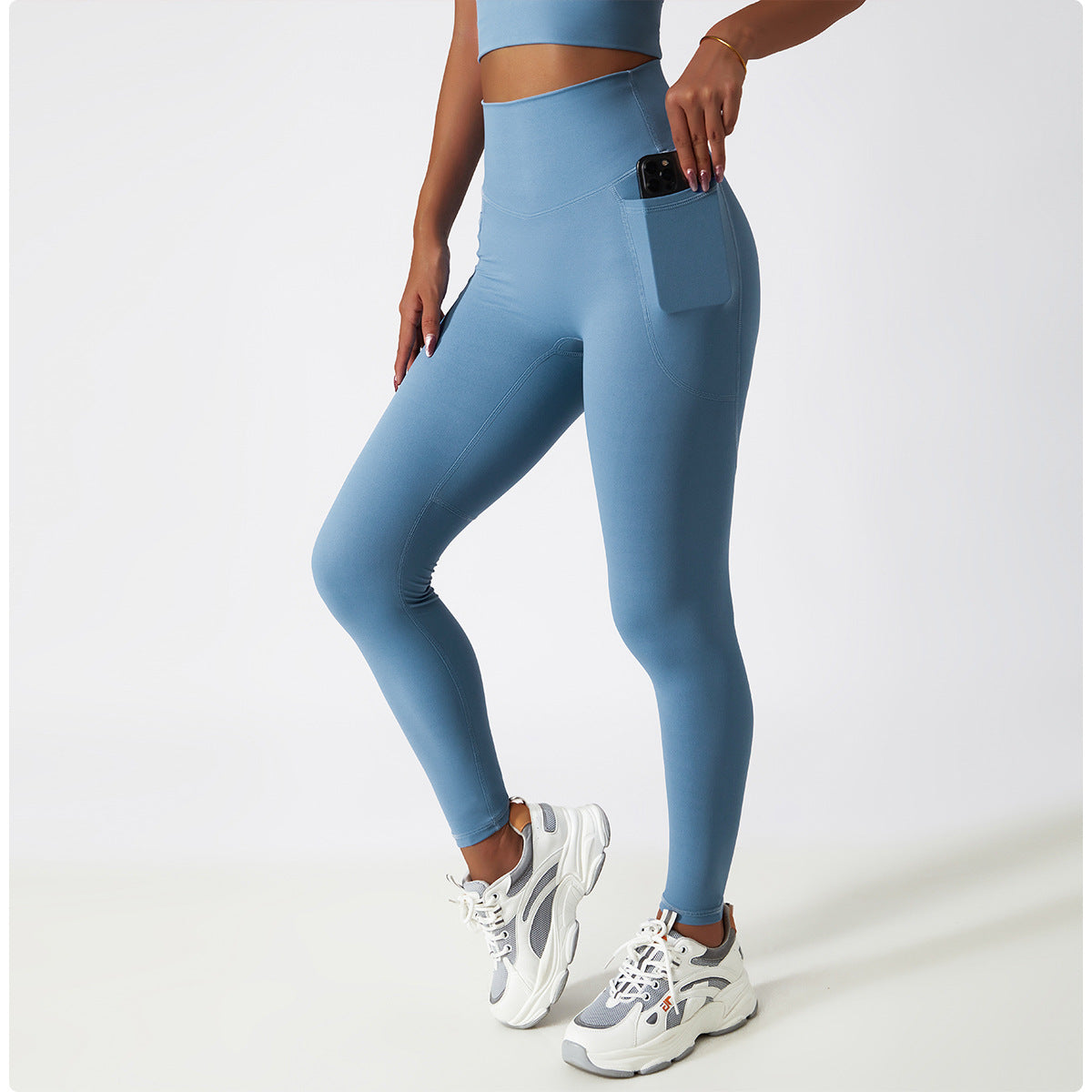 Light blue high-waisted athletic leggings with side pocket for active fashion and comfort