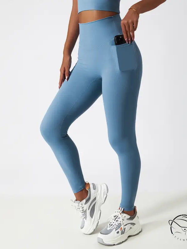 Light blue high-waisted yoga pants with side pocket and hip lift design