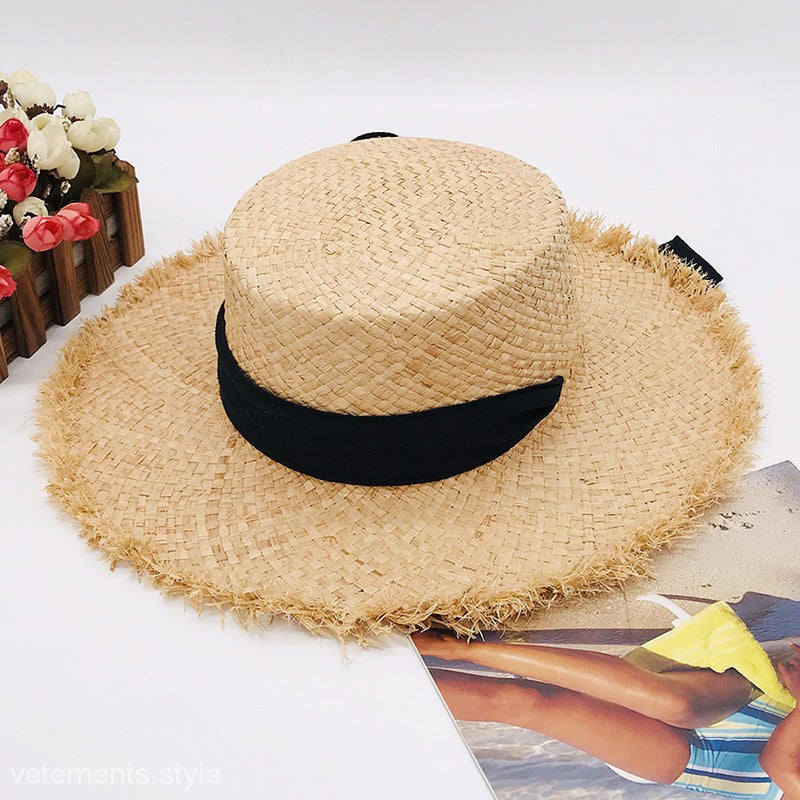 Cute Sun Hat: tan wide-brim straw hat with frayed edges and pure white hatband