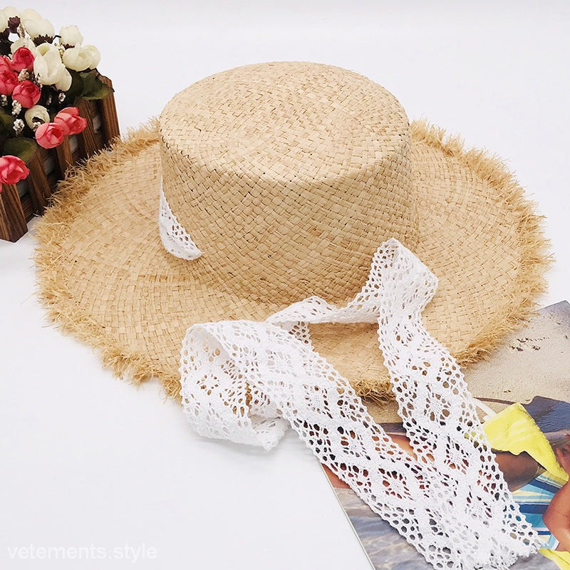 Cute wide-brim sun hat in natural tan with white lace trim and frayed brim