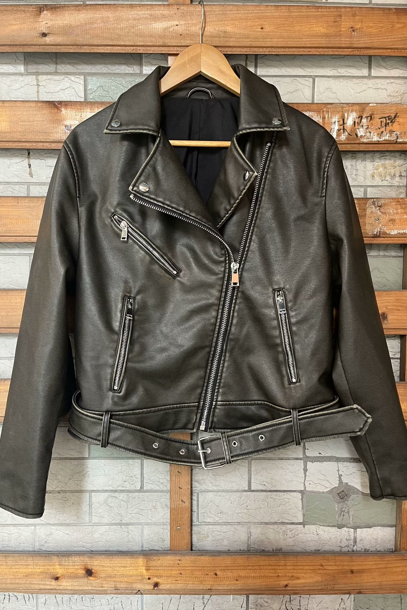 Beautiful warm Langry leather jacket with black leather, silver hardware, and zipper details