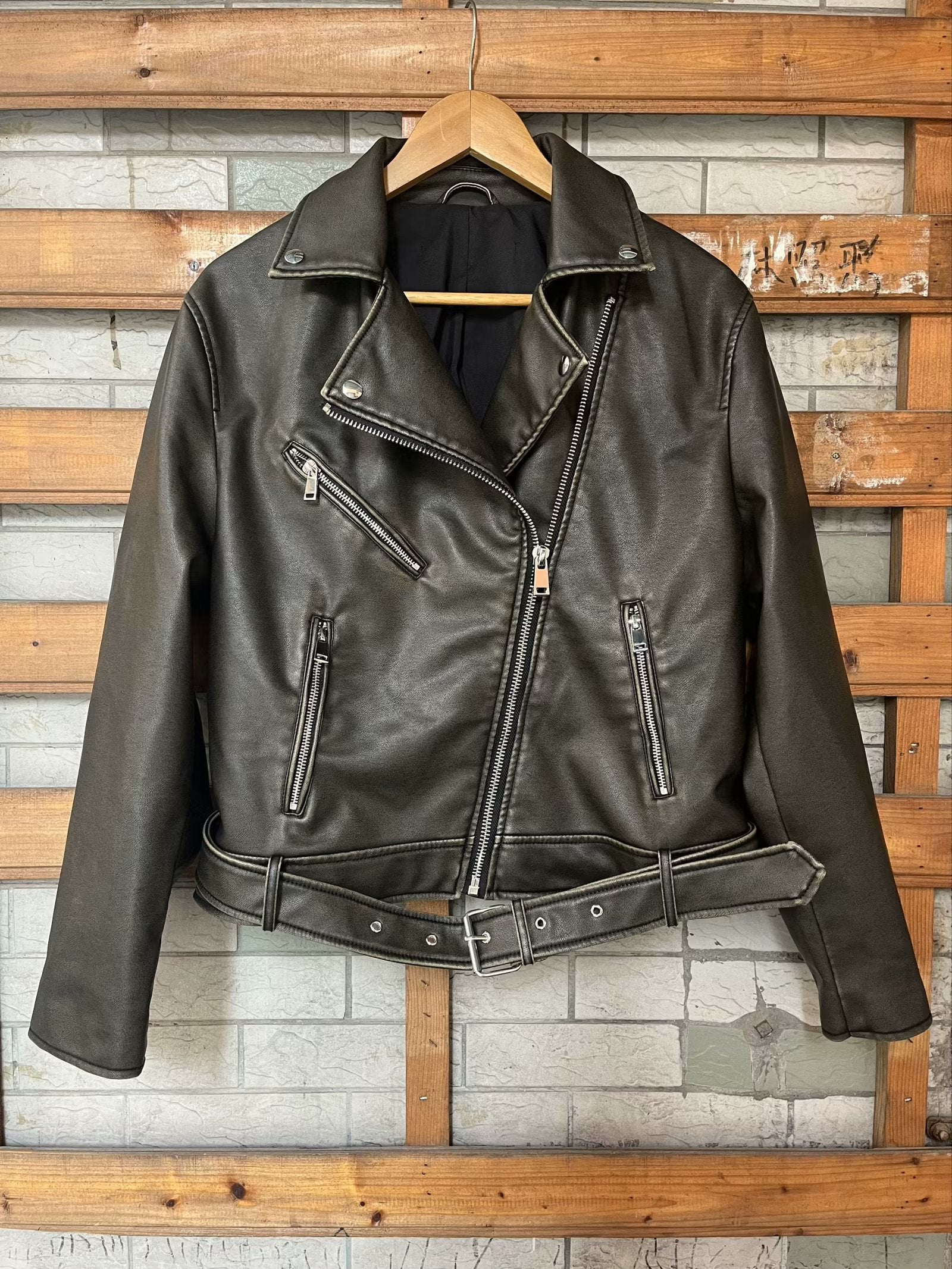 Beautiful warm Langry leather jacket with black leather, silver hardware, and zipper details
