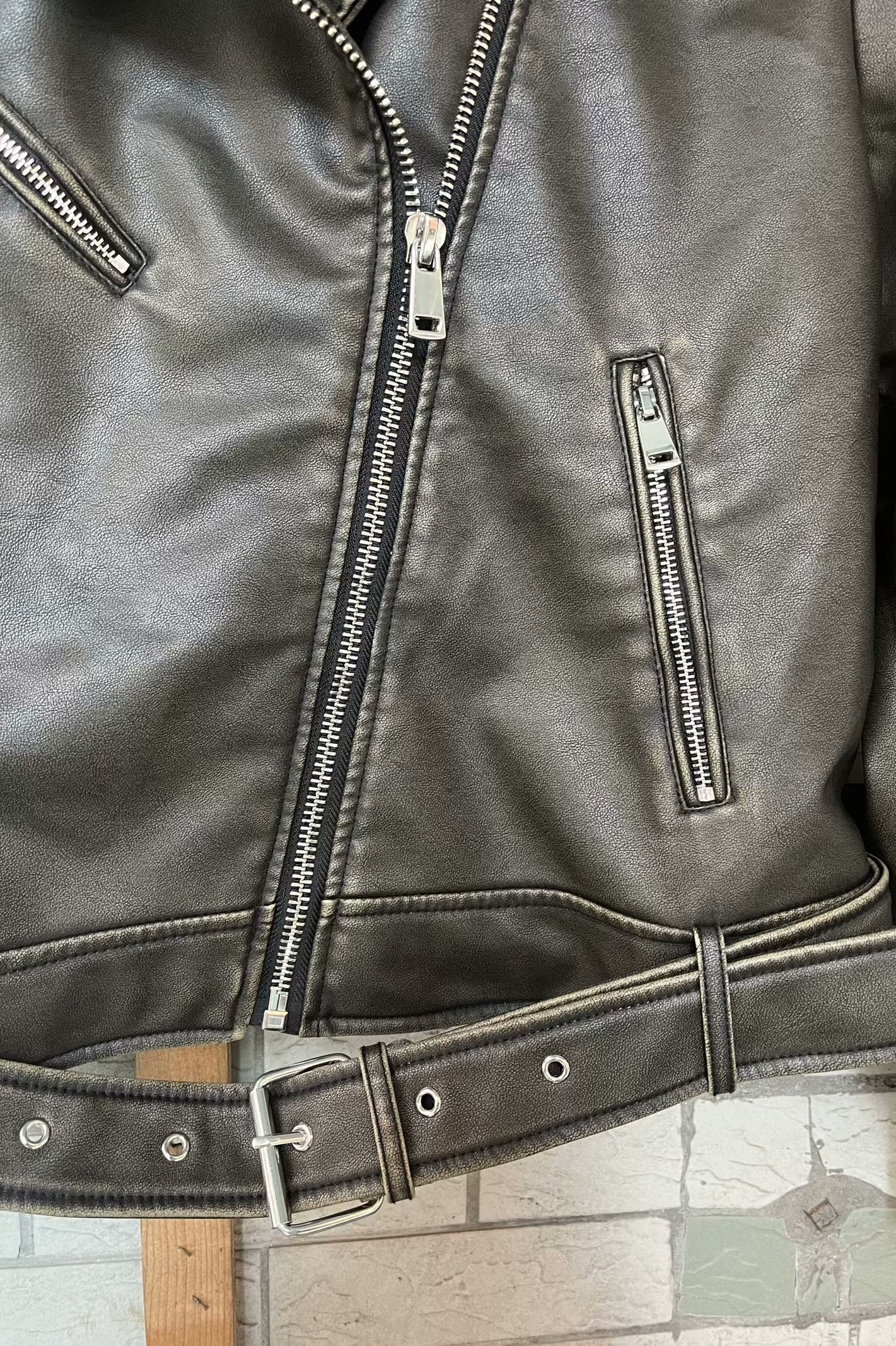 Beautiful warm Langry leather jacket with silver zippers and belt
