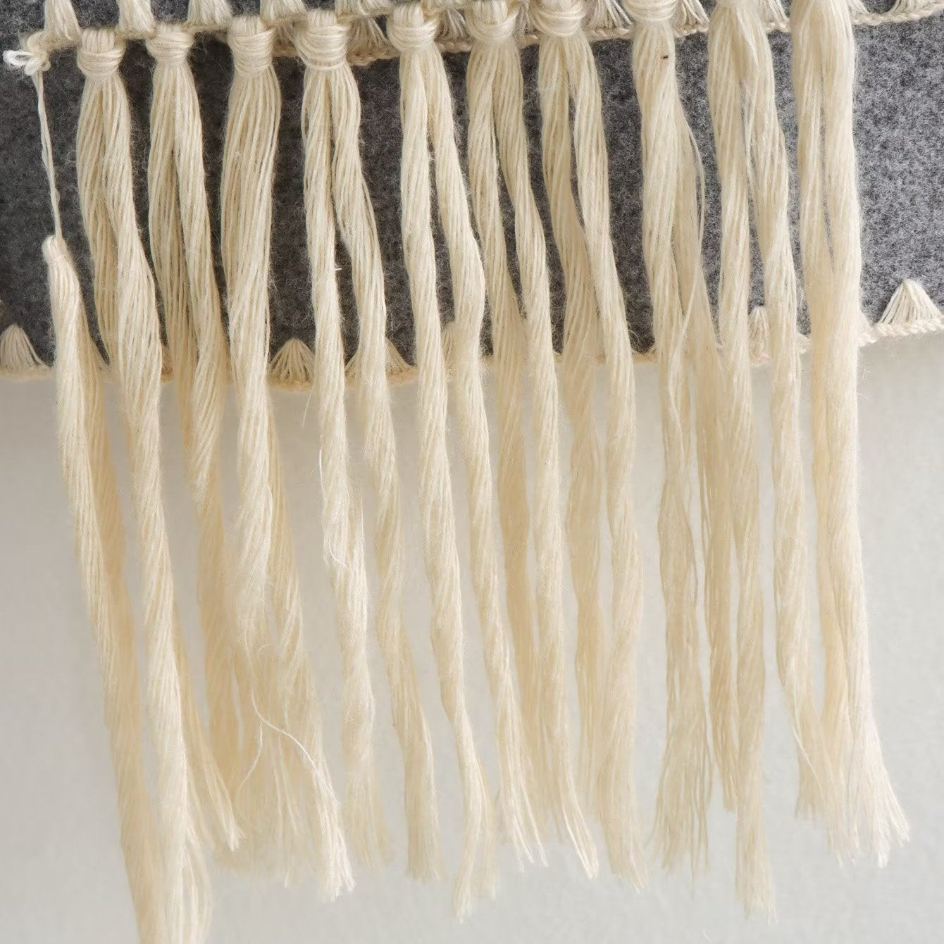 Gray felt with knotted fringe on vintage stitching coat, vintage stitching woolen accessory