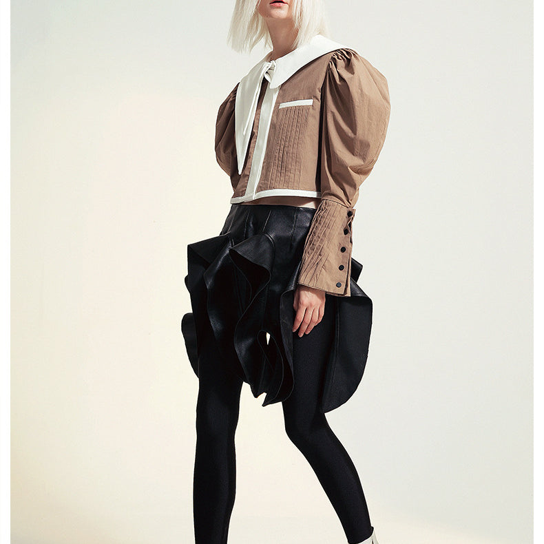 Fashionable woman in avant-garde outfit wearing French Design Short Shirt Jacket, ملابس