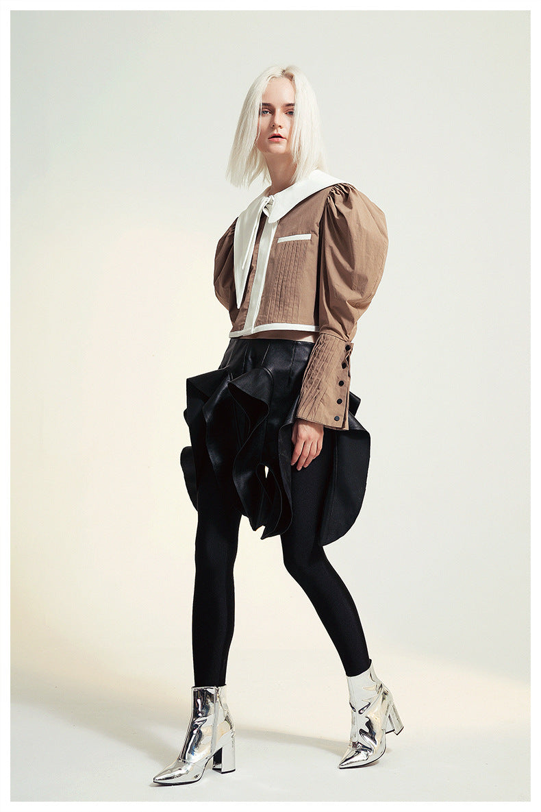 Fashionable woman in avant-garde outfit wearing French Design Short Shirt Jacket, ملابس