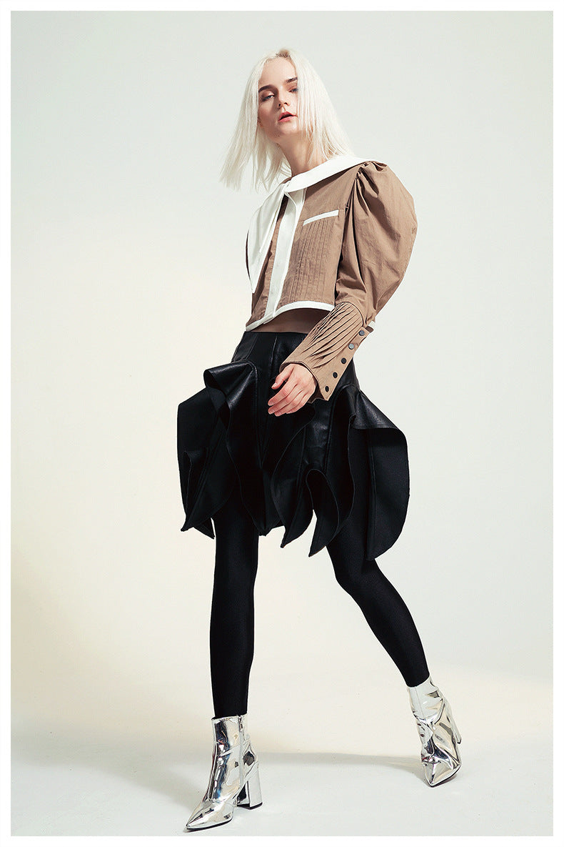 Fashionable woman in avant-garde French Design Short Shirt Jacket showcasing langry style and ملابس