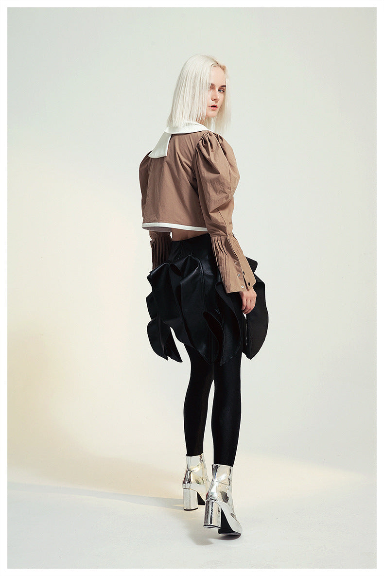 Fashionable woman in avant-garde French Design Short Shirt Jacket showcasing modern ملابس style