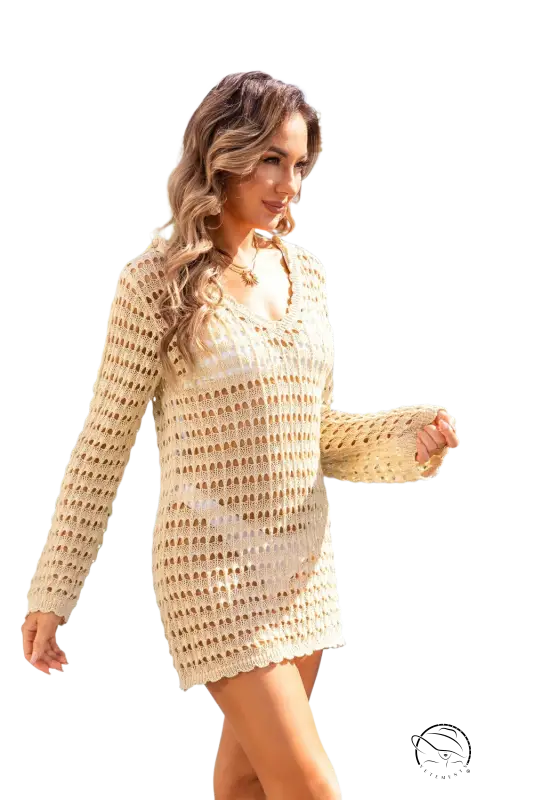 Beige knitted crochet summer beach blouse with long sleeves and v-neckline