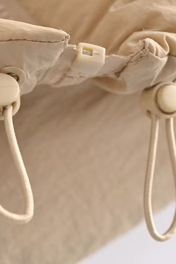 Langry fashion beige canvas drawstring bag with white cord closure