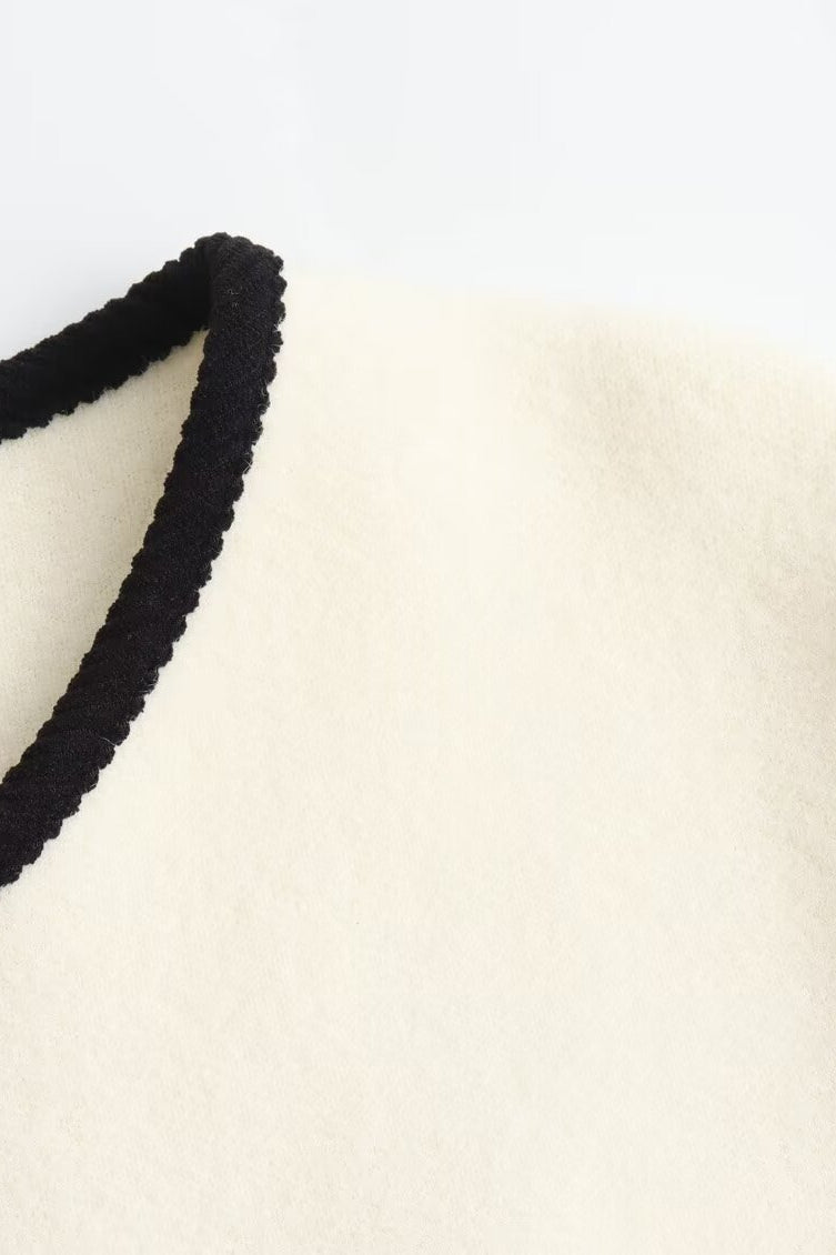 Langry fashion white Chanel jacket with black trim and gold buttons