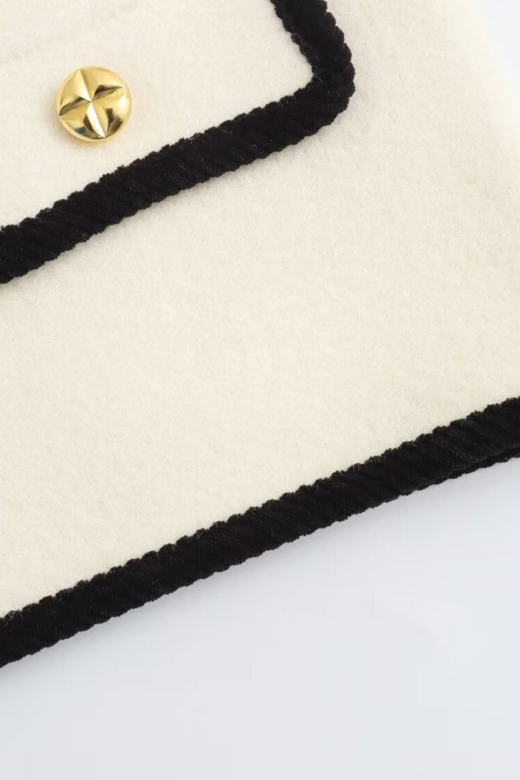 Langry fashion cream and black crocheted clutch with gold button