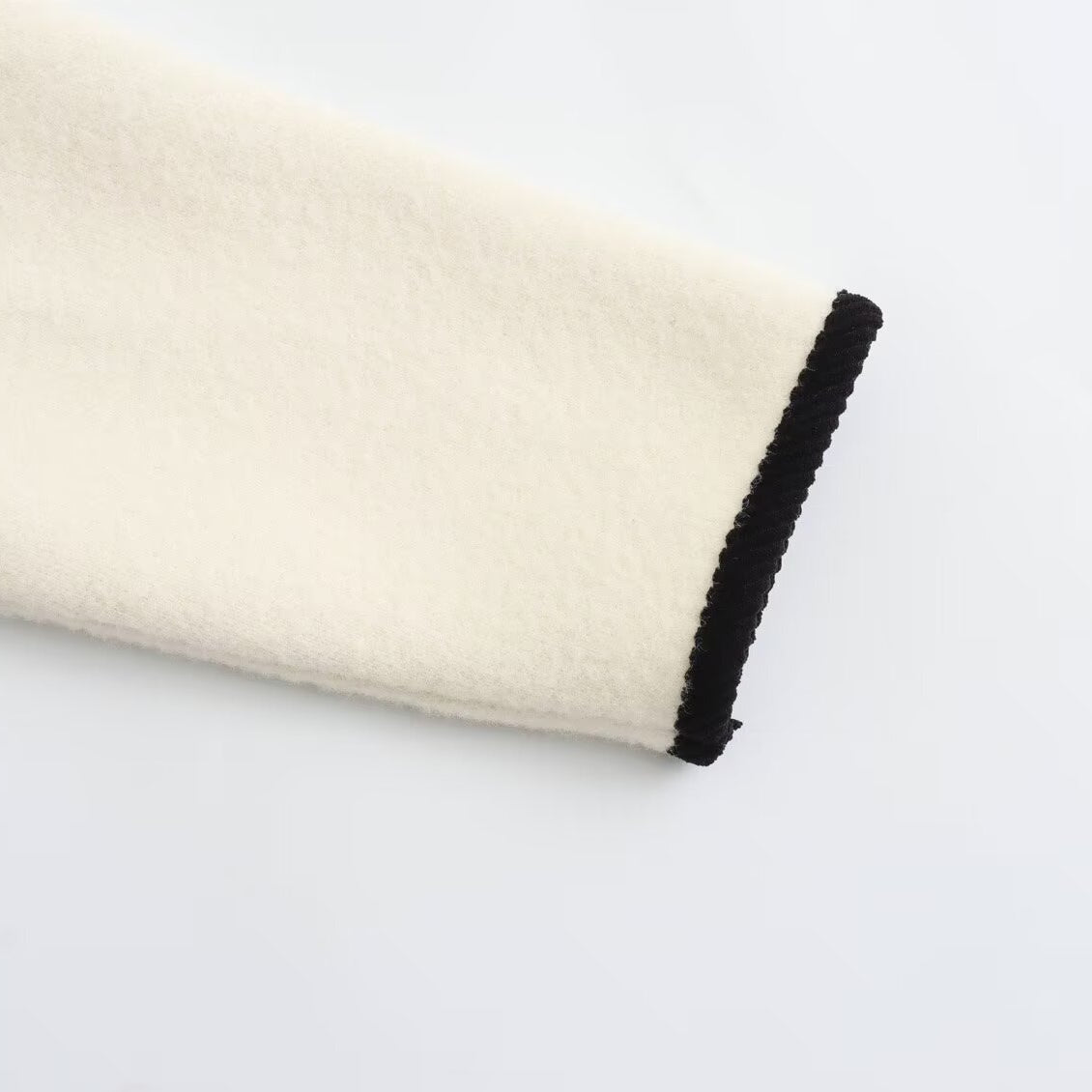 Classic white and black trim sleeve for Langry fashion knitted coat
