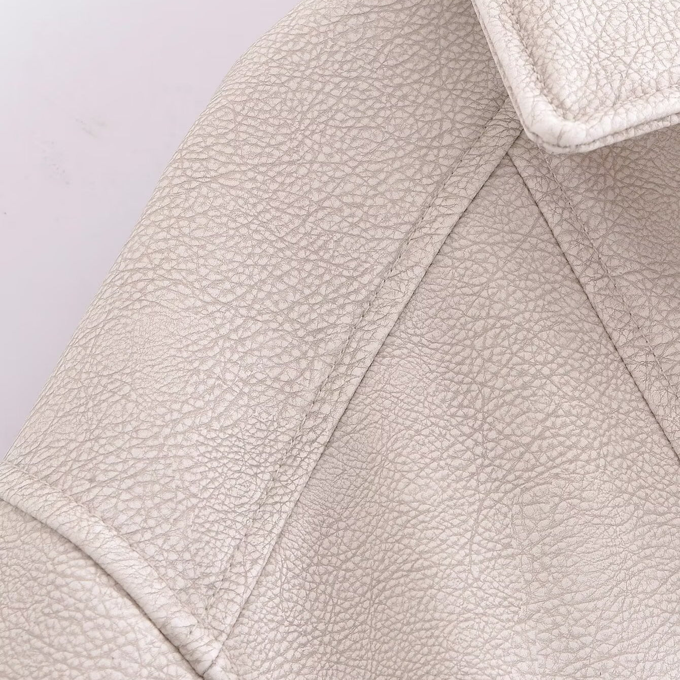 Retro washed faux leather jacket with cream textured surface and notched lapels