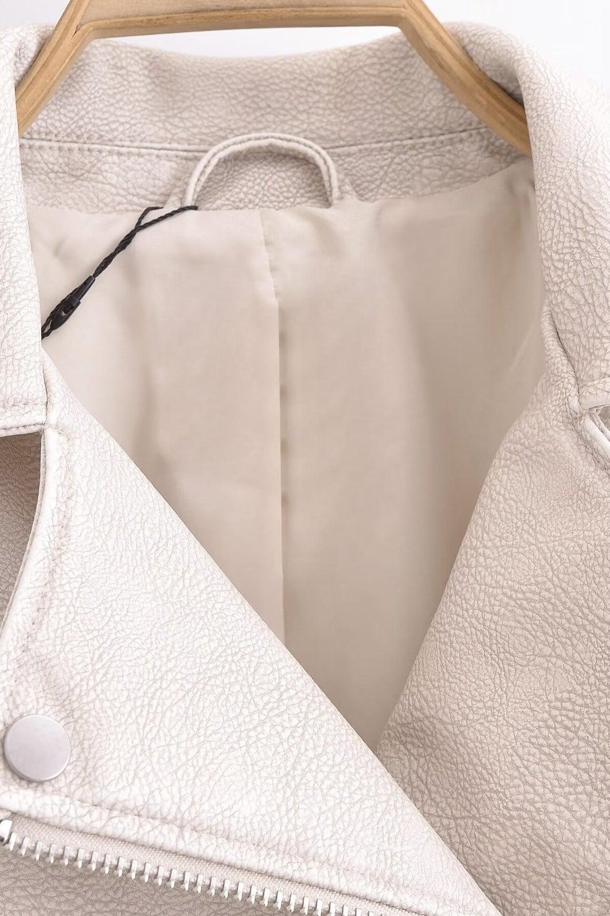 Cream faux leather jacket with zipper and button closure