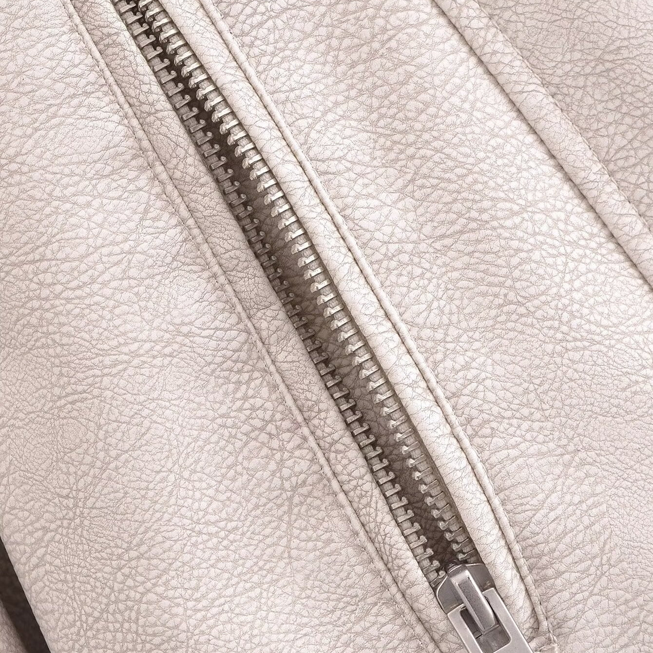 Silver zipper on retro washed faux leather jacket