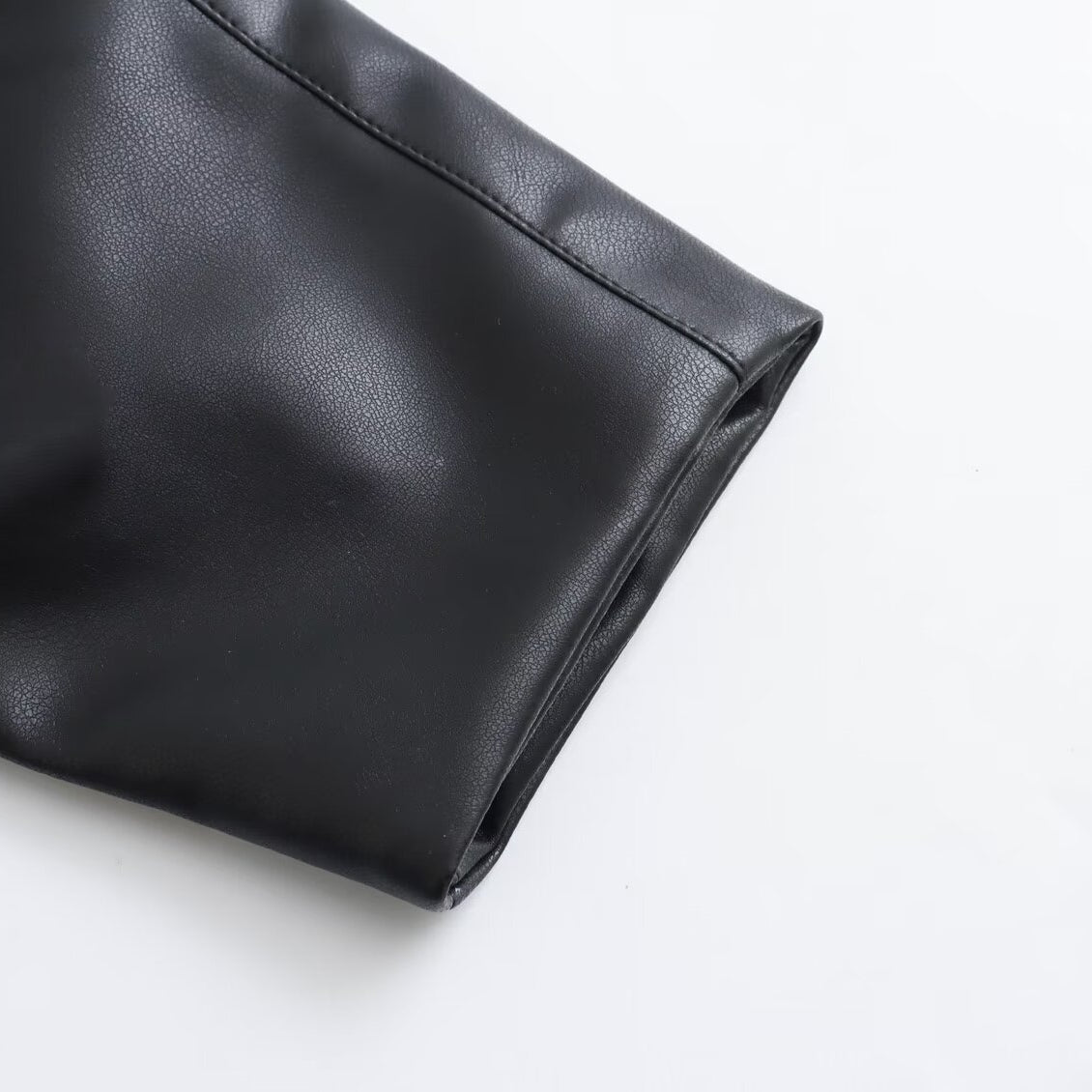 Langry faux leather clutch bag with smooth rounded corners for fashion