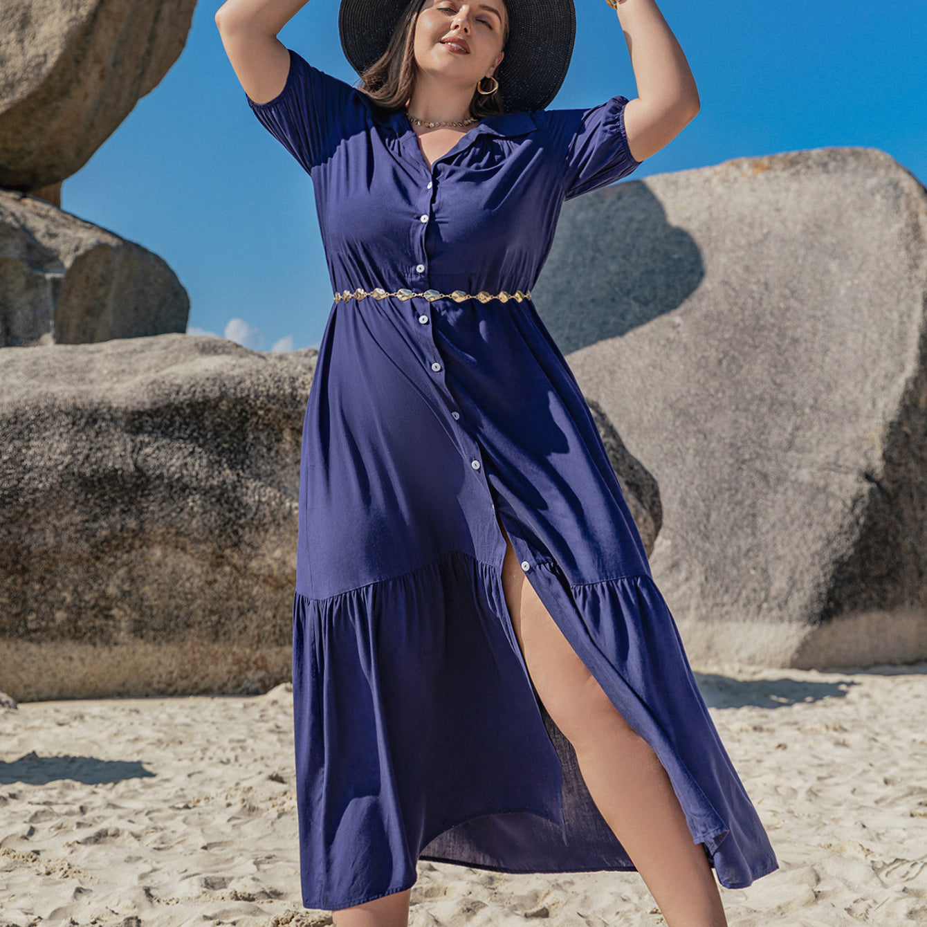 Plus-size woman in navy blue Bohemian Mixed Batch Loose Dress with sun hat and gold accessories