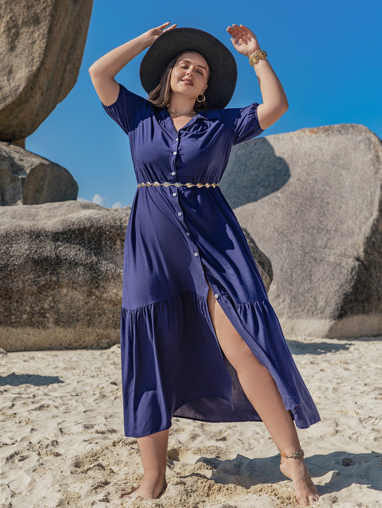 Plus-size woman in navy blue Bohemian Mixed Batch Loose Dress with sun hat and gold accessories