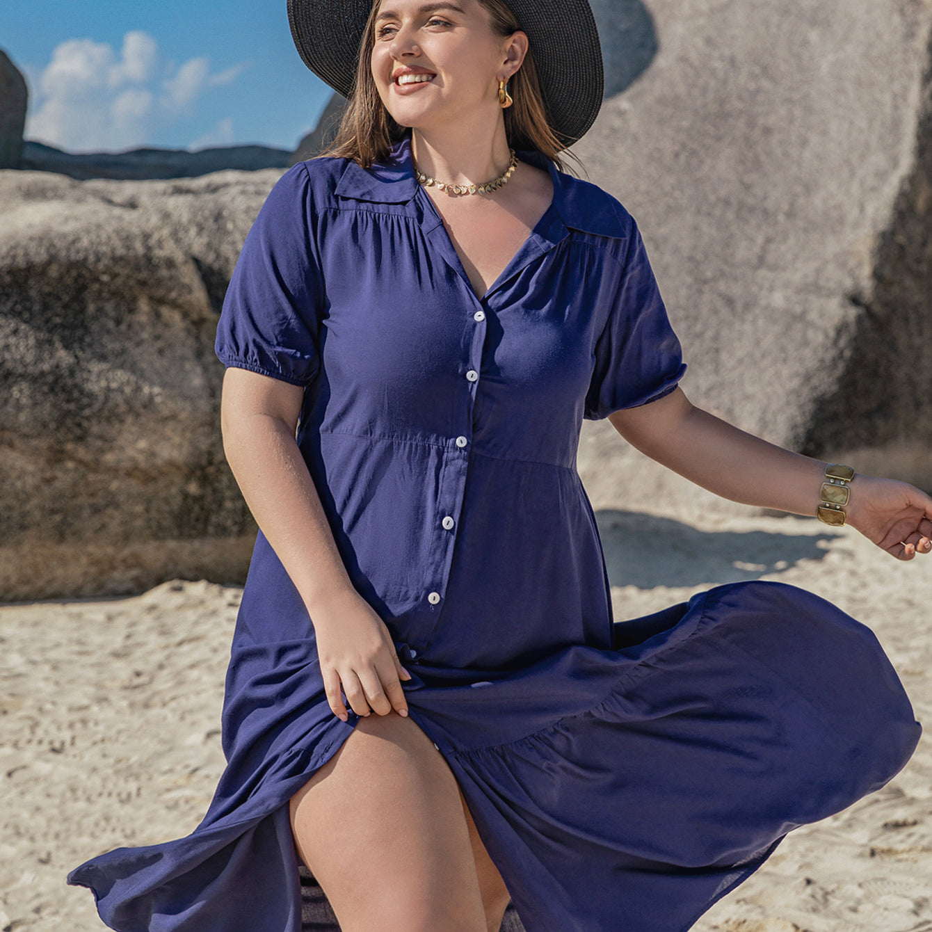 Elegant woman in navy blue Bohemian Mixed Batch Loose Dress with black wide-brimmed hat
