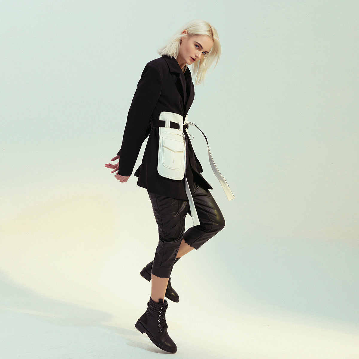 Elegant Black White Retro Blazer worn by woman in fashion-forward black blazer and boots