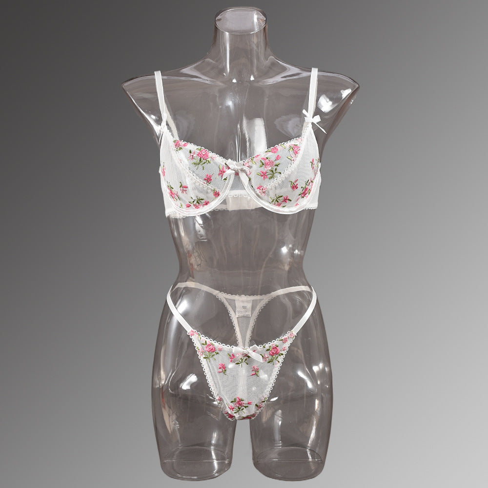 Floral-embroidered lingerie set on mannequin showcasing elegant fashion and ملابس style