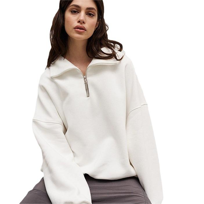 Woman in white zip-up sweatshirt showcasing Langry fashion for autumn winter ملابس