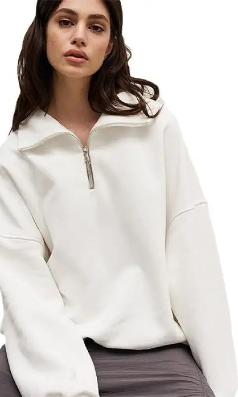 Woman in white half zipper autumn winter fleece lined sweater
