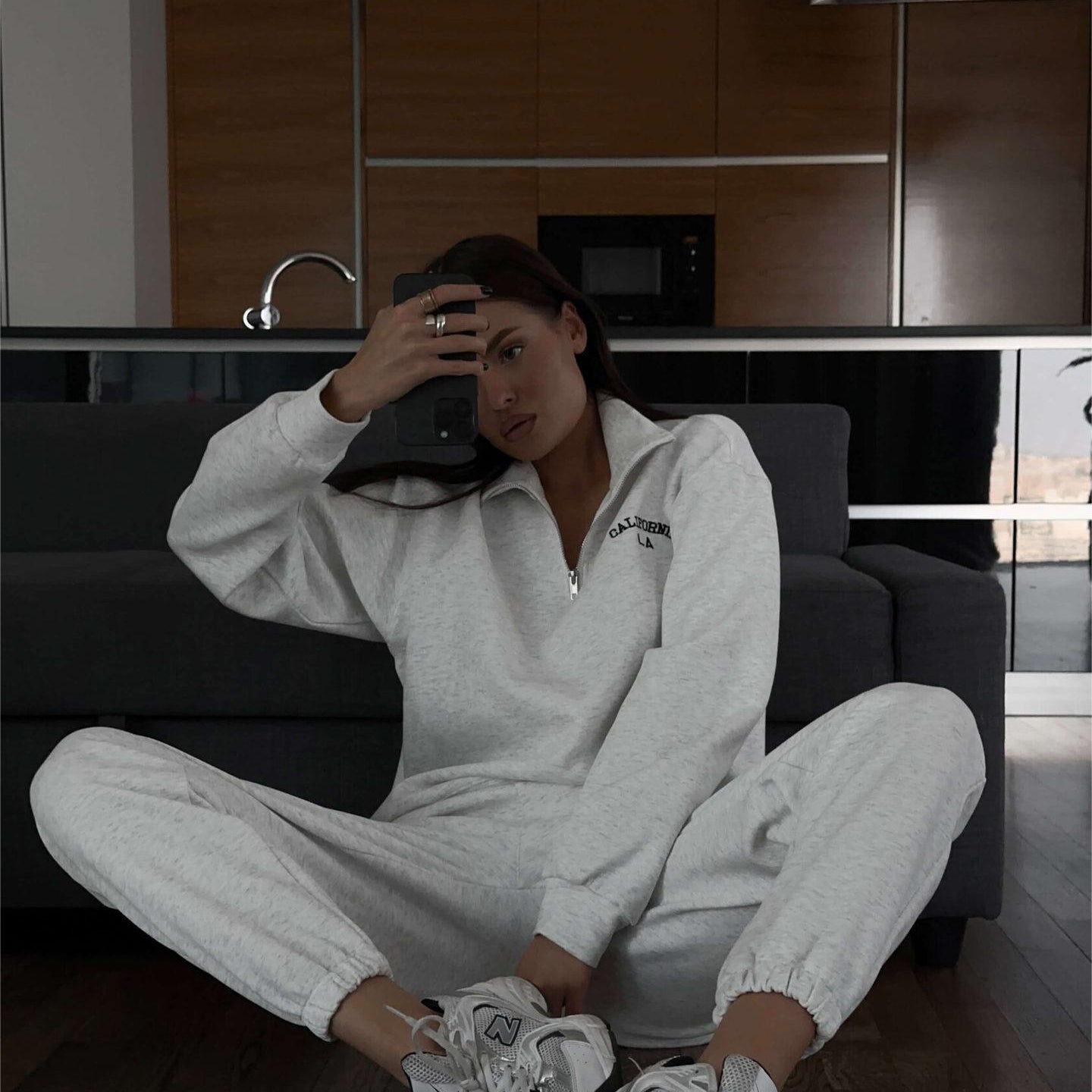 Woman in white tracksuit and sneakers wearing Langry Autumn Winter fleece lined top