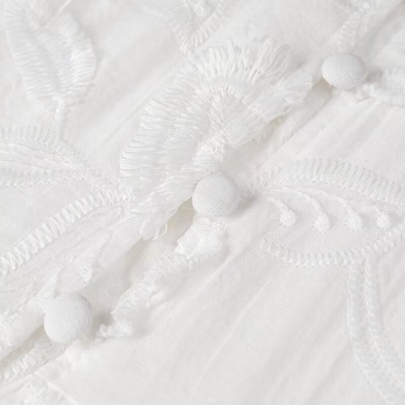 White embroidered fabric with buttons on a Fairy Retro French V Neck maxi dress