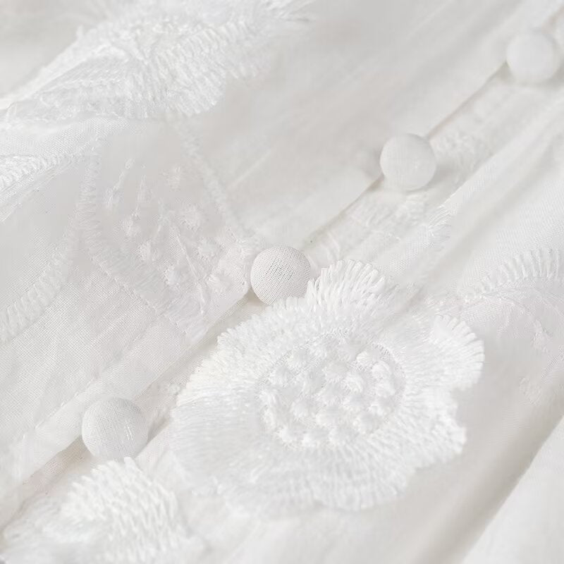 White embroidered fabric with buttons on a Fairy Retro French V Neck maxi dress for women