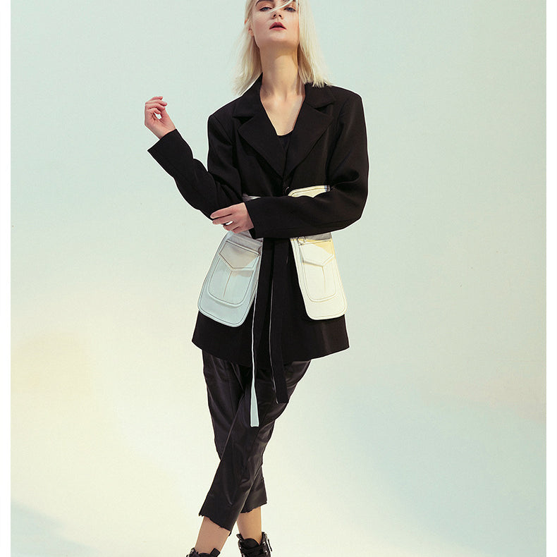 Elegant black white retro blazer worn by woman in fashionable langry ملابس look