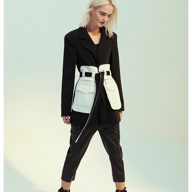 Elegant black and white retro blazer worn by a woman in fashion attire, ملابس style