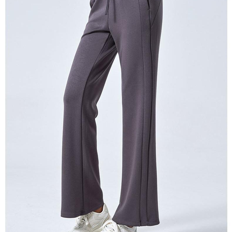 Gray flared athletic pants for women featuring drawstring waist and double pockets, ideal fashion ملابس