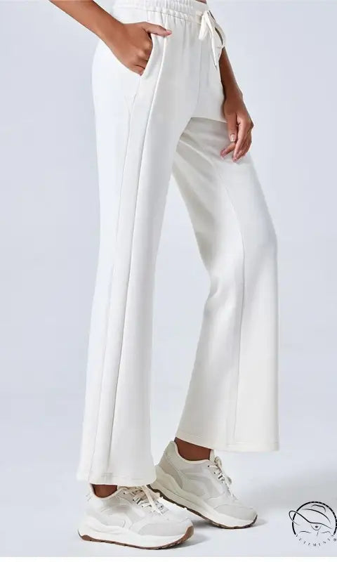 White summer air layer wide-leg cotton pants with cream sneakers