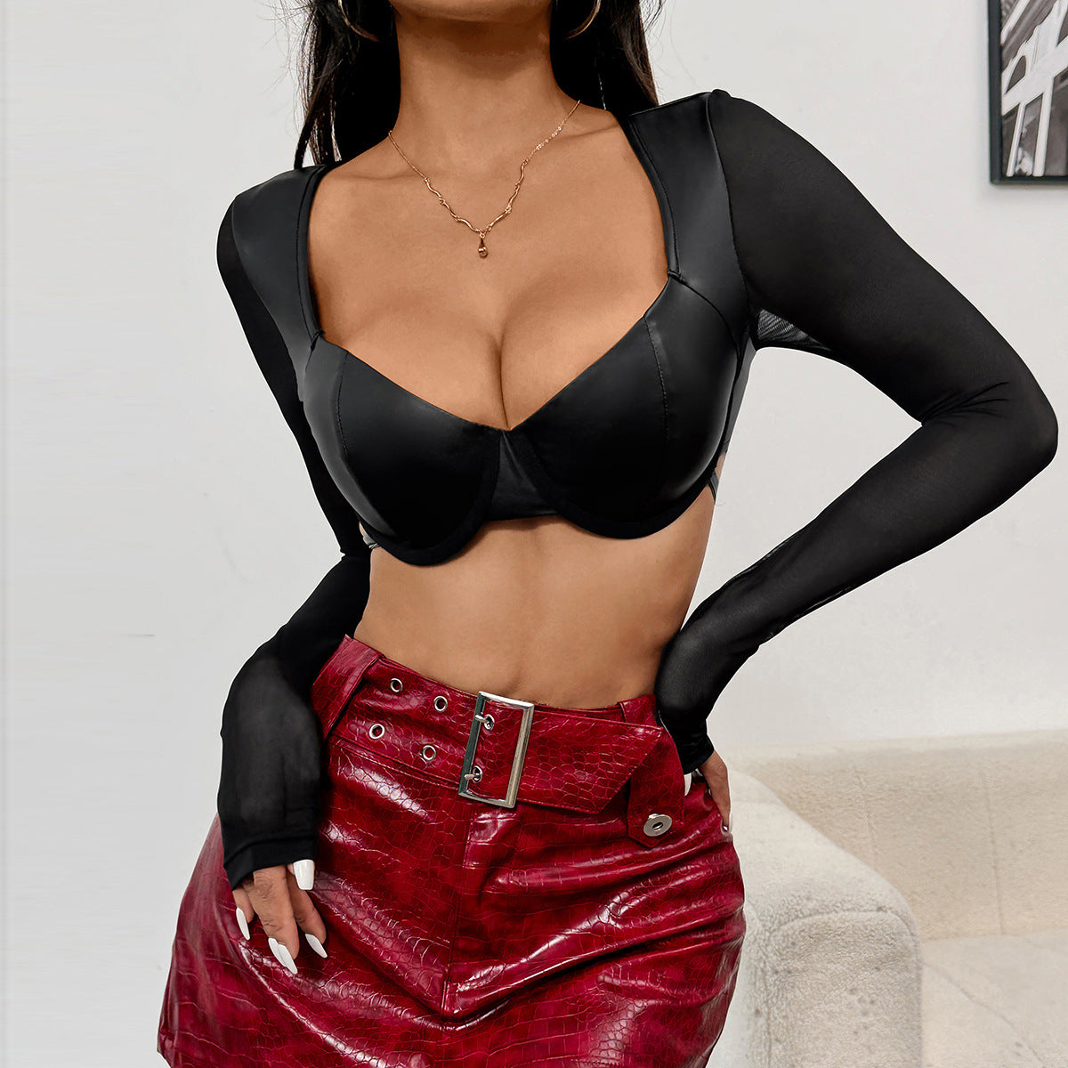 Black short cropped faux leather top with tied long sleeves and sweetheart neckline