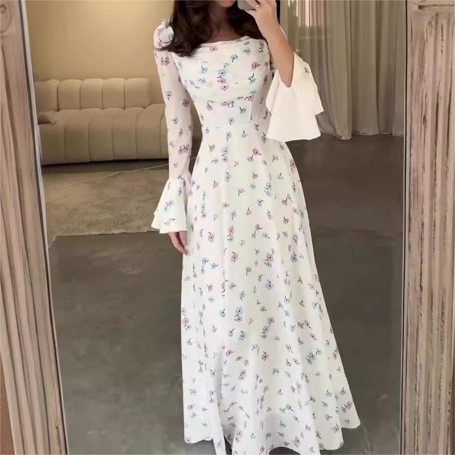 Floral white maxi dress with flared sleeves, perfect for summer fashion