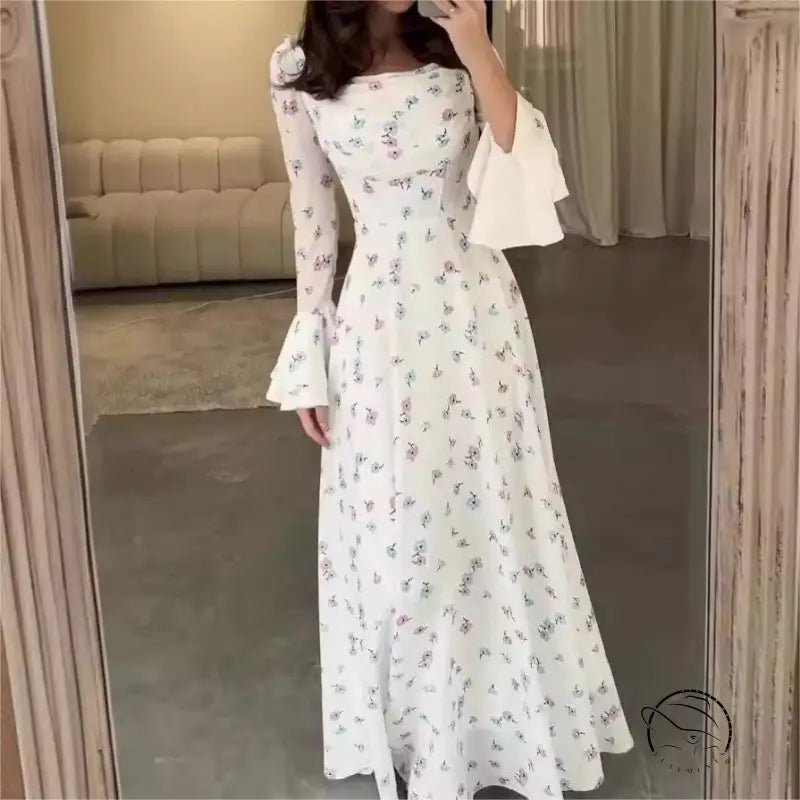 Elegant floral white maxi dress with flared sleeves for summer fashion