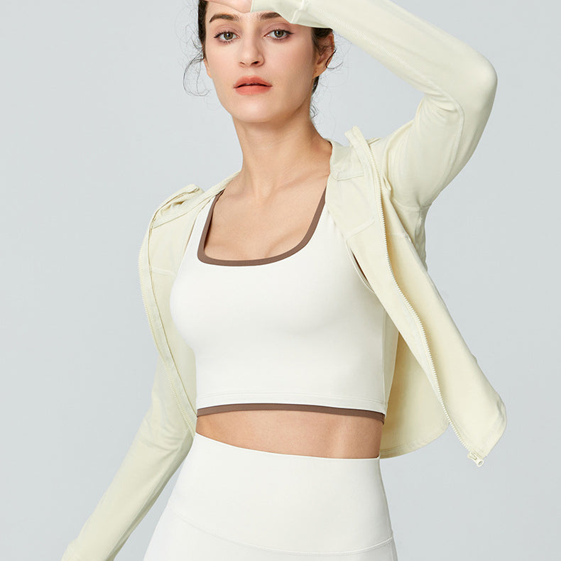 Woman in athletic wear showcasing Langry Sports Long Sleeved Jacket for workout fashion ملابس