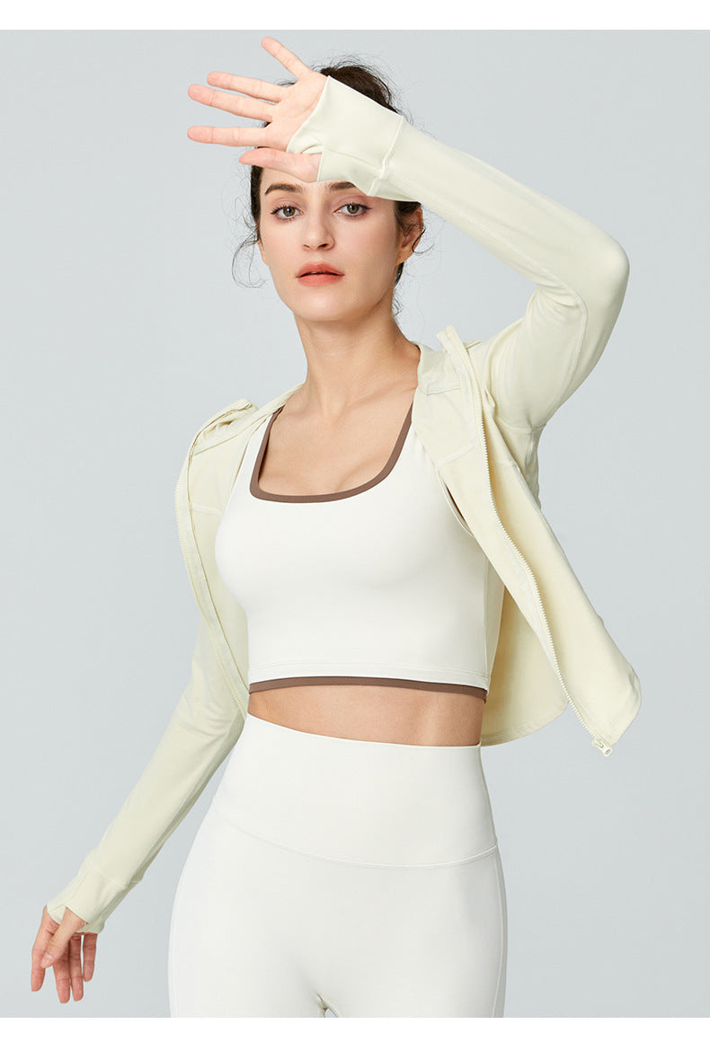 Woman in athletic wear showcasing Langry Sports Long Sleeved Jacket for workout fashion ملابس