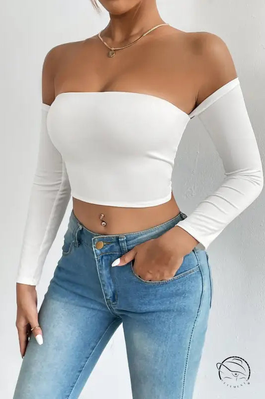 White off-shoulder camisole waist trimming short sleeve crop top with light wash jeans