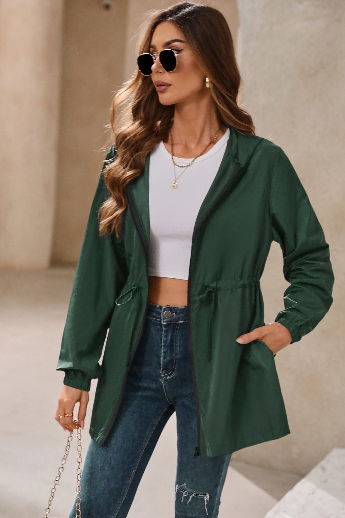 Green hooded outdoor raincoat with drawstring, ideal for outdoor activities and mountaineering