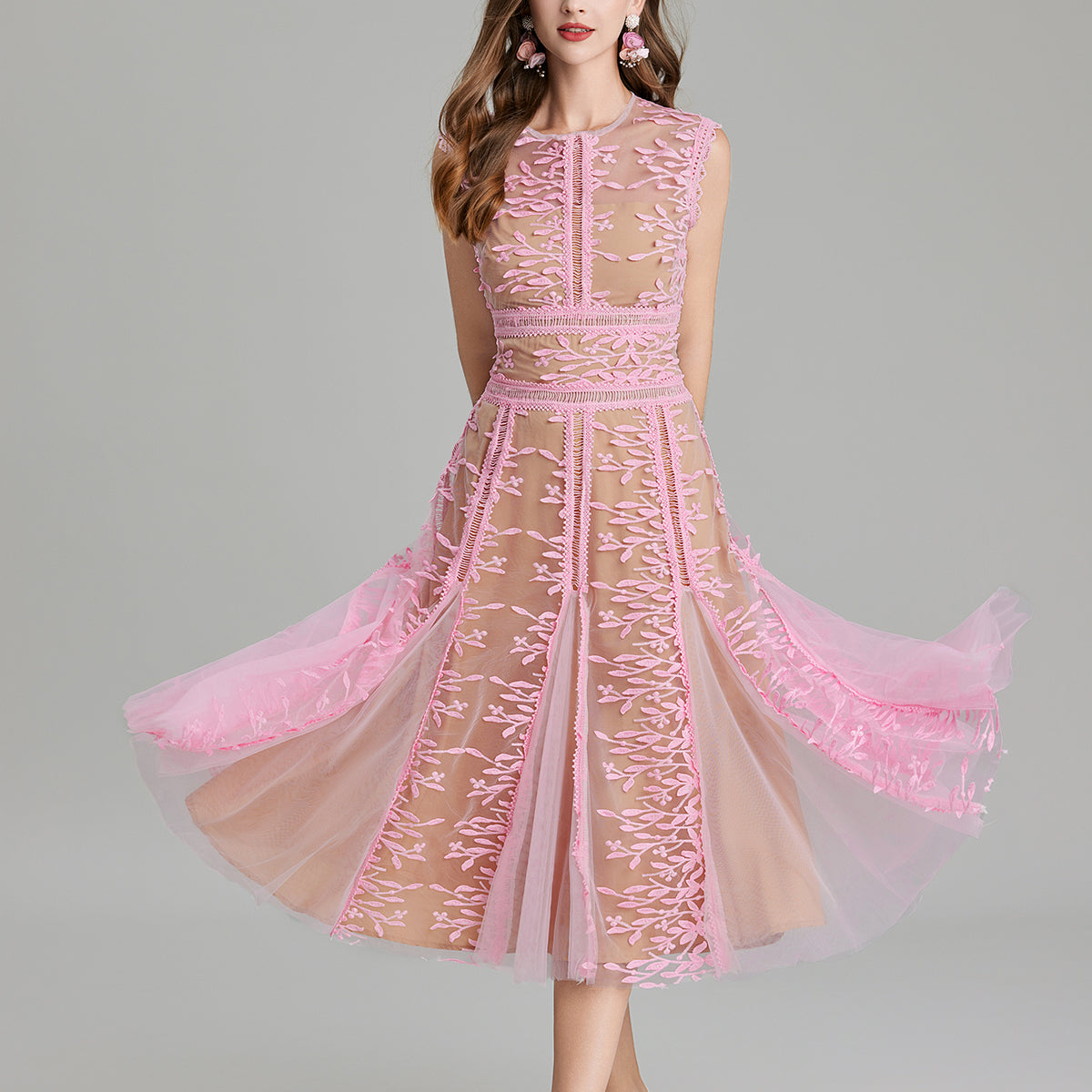 Pink lace midi dress featuring embroidered three dimensional mesh and intricate stitching