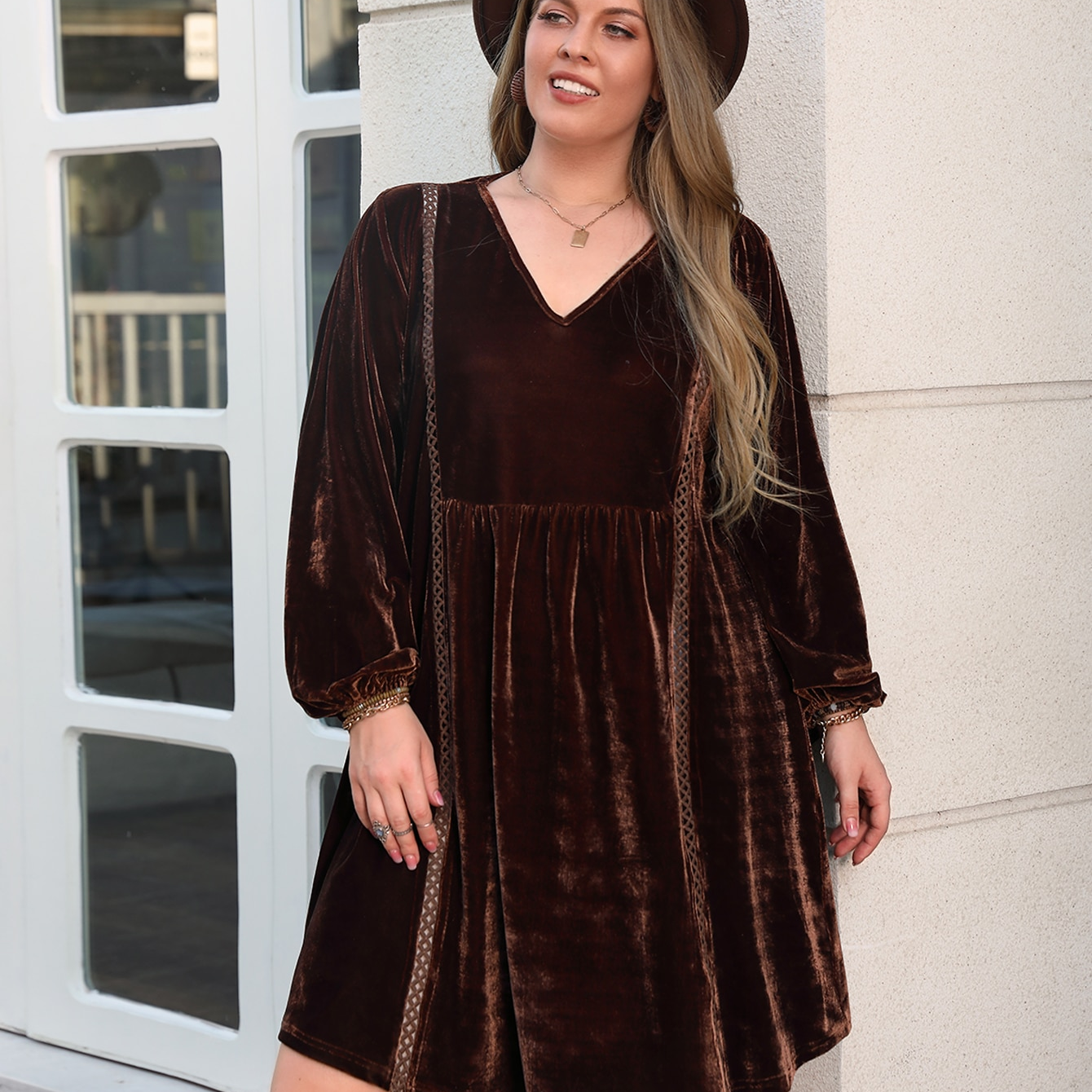 Plus-size brown velvet babydoll dress with long bishop sleeves, ideal for loose slimming casual style