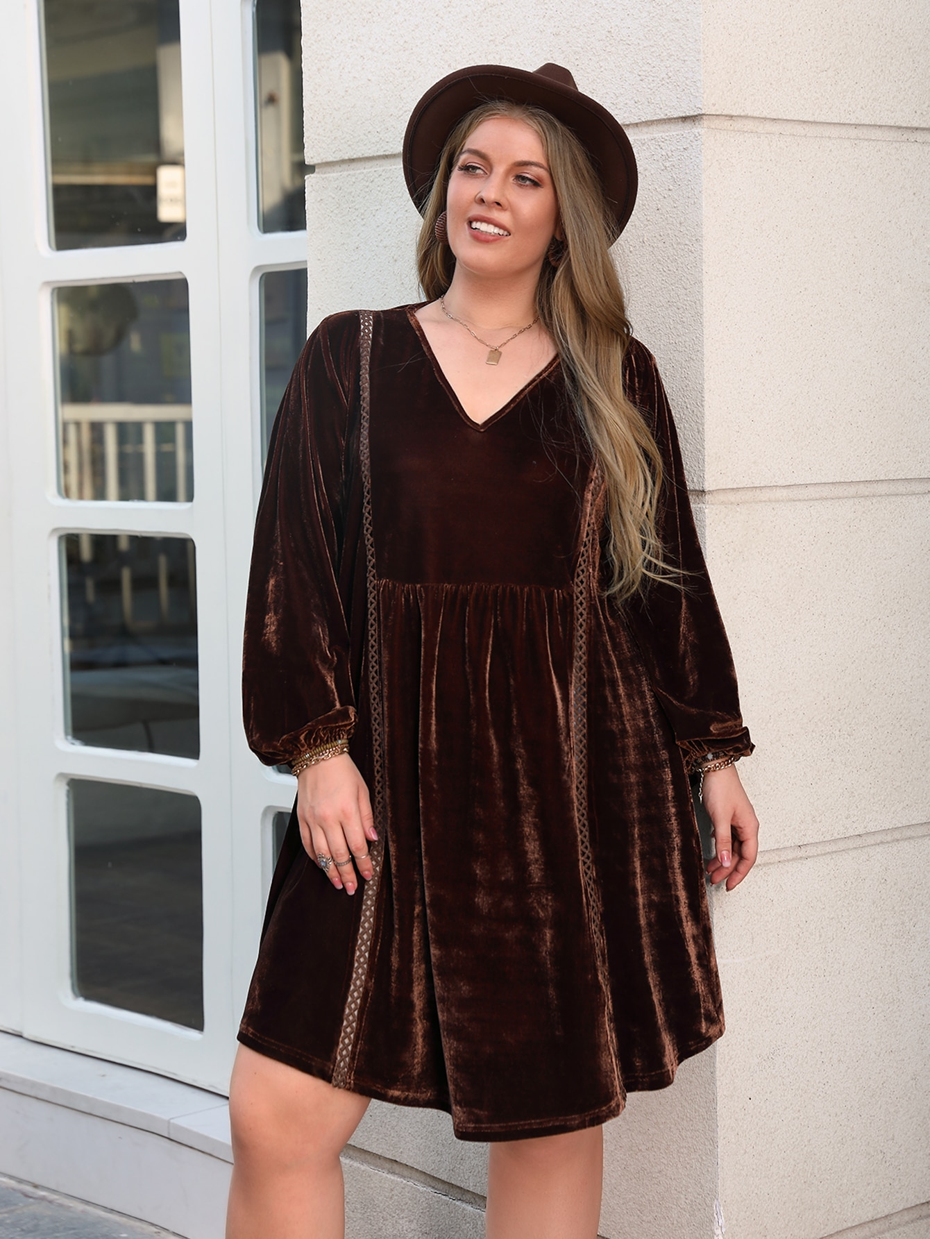 Plus-size brown velvet babydoll dress with long bishop sleeves, ideal for loose slimming casual style