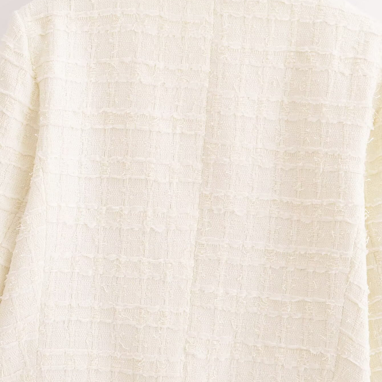 White textured woolen sweater with grid pattern on wooden hanger, Langry fashion ملابس