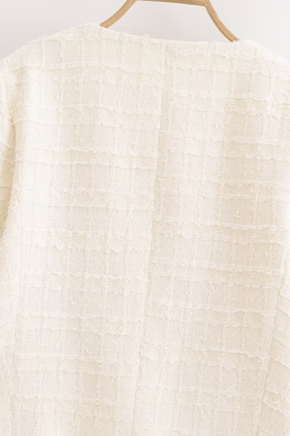 White textured woolen sweater with grid pattern on wooden hanger, Langry fashion ملابس